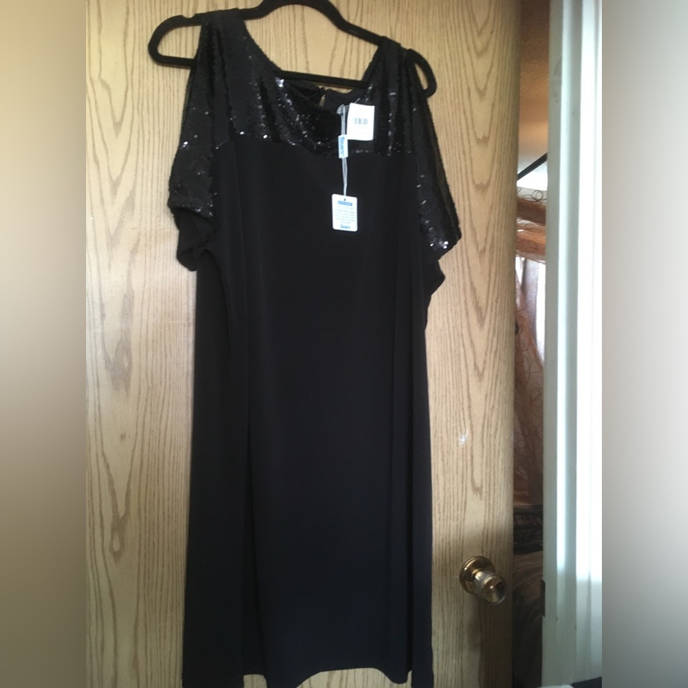 Beautiful Brand new with tags. Sears size 18 black sequin dress. With cap sleeve